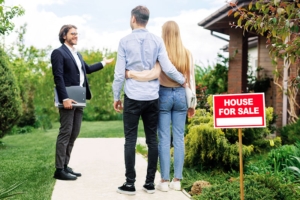 About Us! Be Part of The 1 Powerful Real Estate Brokers Team real estate broker showing house for sale to young 2021 08 28 11 04 49 utc